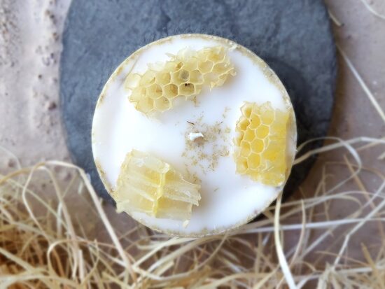 Natural soy wax candle with honey cells and scented with mild linden aroma 